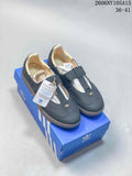 Pair of dark blue adidas Originals Samba Jane Mary Jane shoes with gum-colored soles, shown on a blue shoe box.