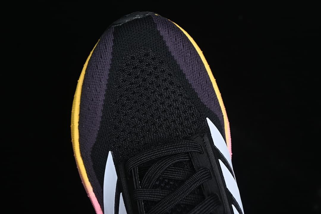 Top-down view of the black knit toe and purple side panels.