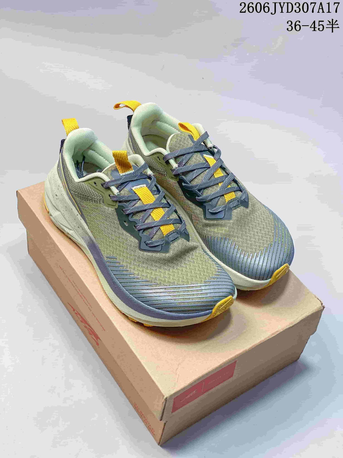 Pair of Altra Experience Wild 2 running shoes in green, blue, and yellow, shown from above.