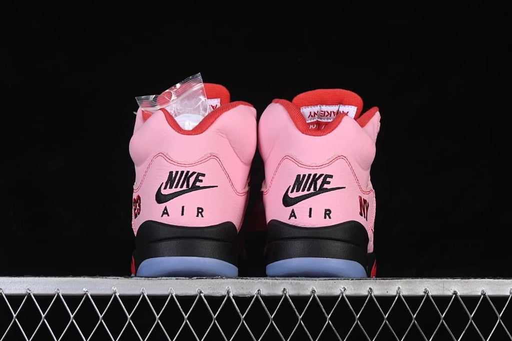 Rear view of the pair with Nike Air heel branding and translucent outsole sections.