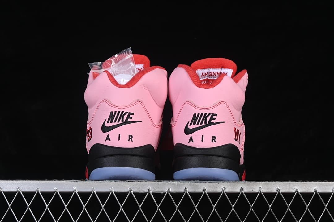 Rear view of the pair with Nike Air heel branding and translucent outsole sections.
