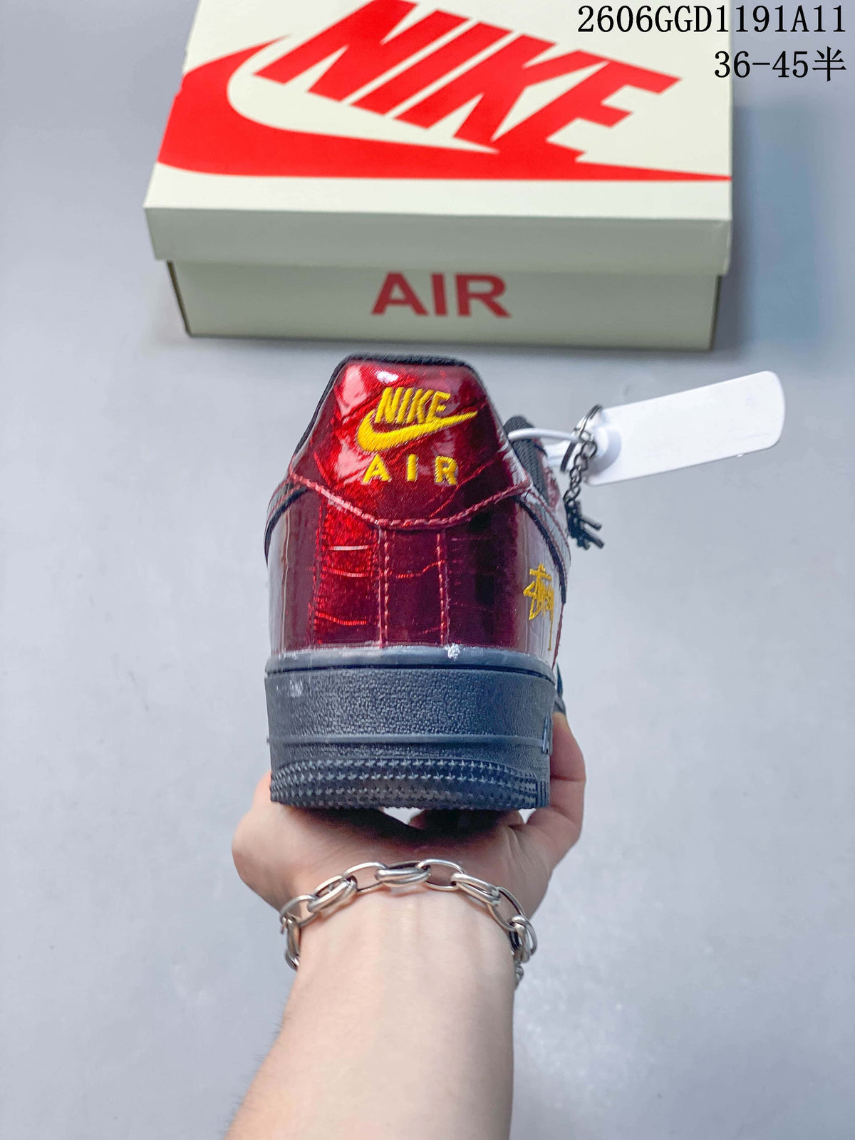 Rear view showing the burgundy heel panel and yellow heel embroidery