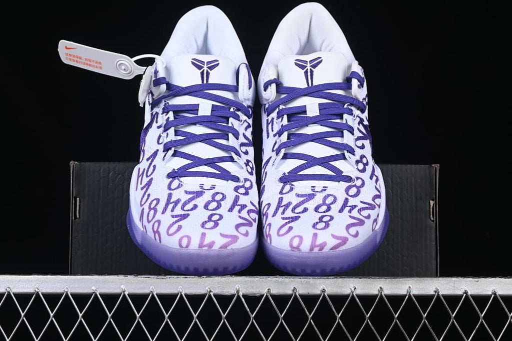 Front view of the pair showing patterned toes and purple laces