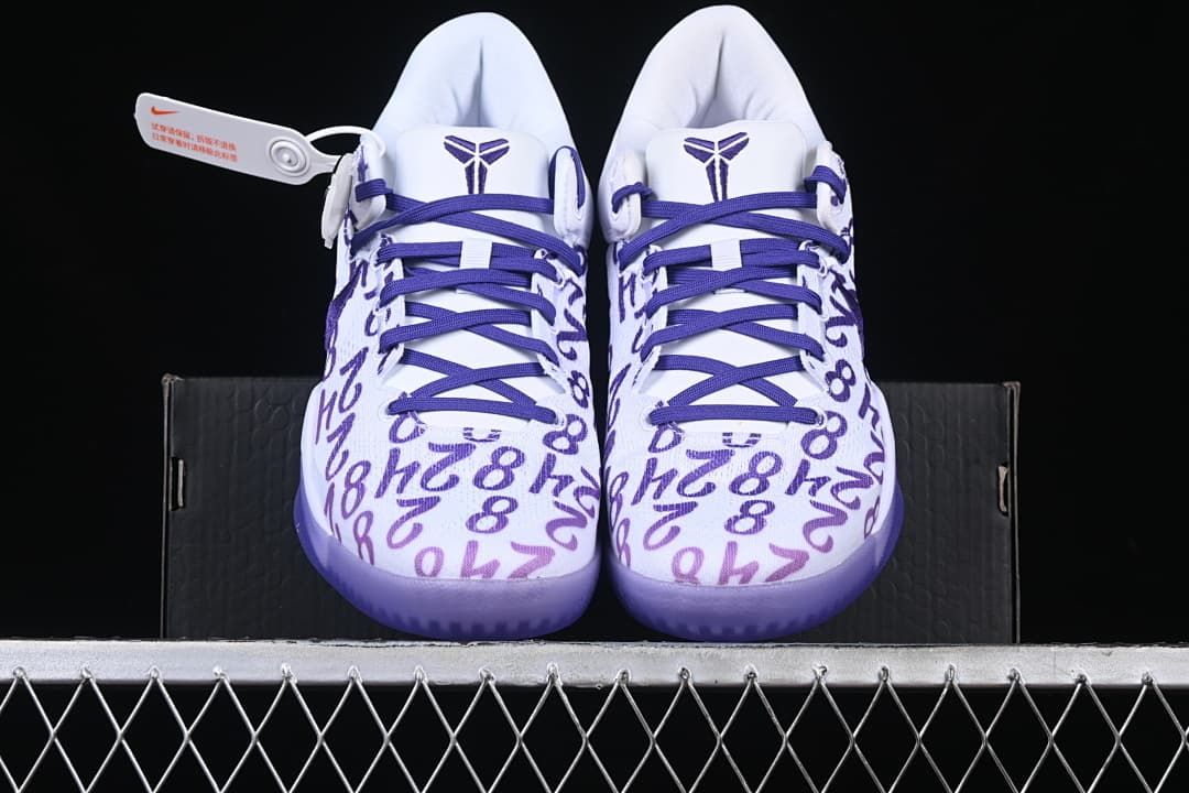 Front view of the pair showing patterned toes and purple laces