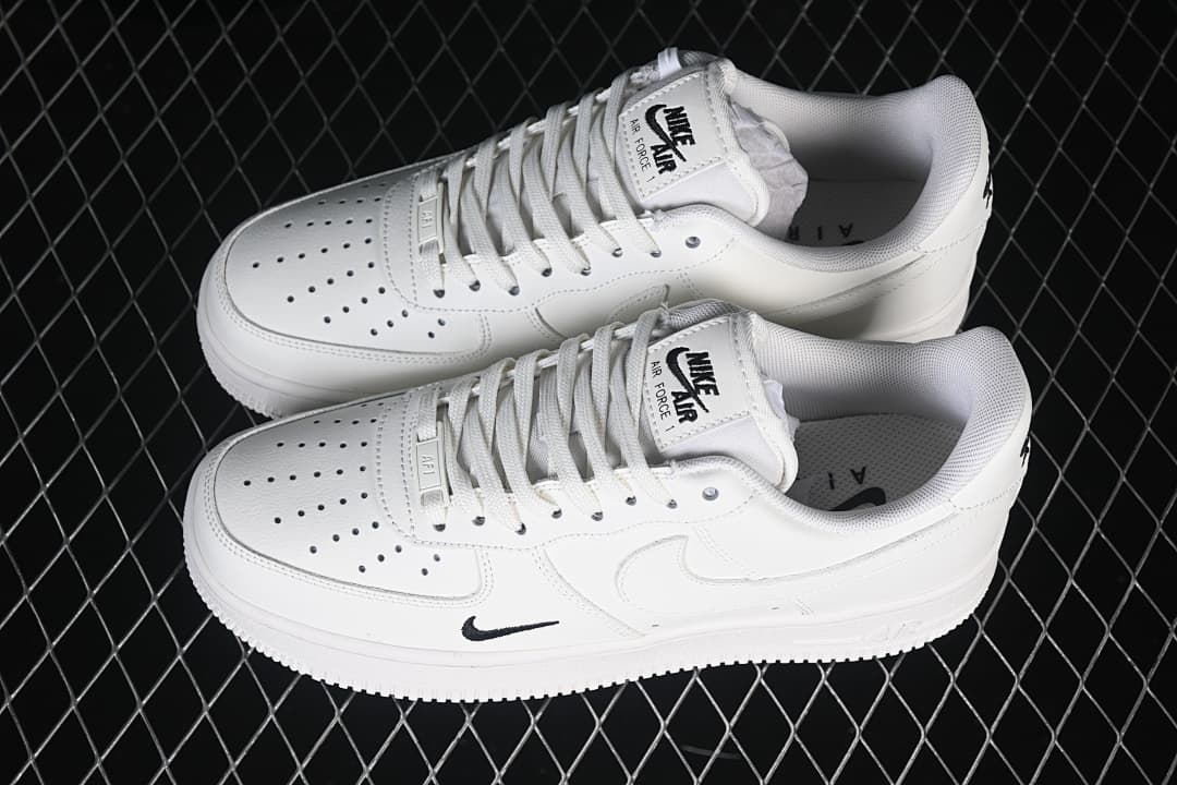 Pair of white low-top sneakers shown from above at an angle