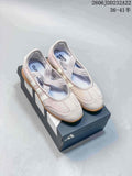 Pair of light pink Adidas Barreda Mary Jane shoes with crossed straps and gum-colored soles