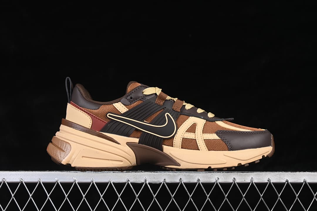 Side view of brown and beige Nike V2K Run sneakers with dark brown accents