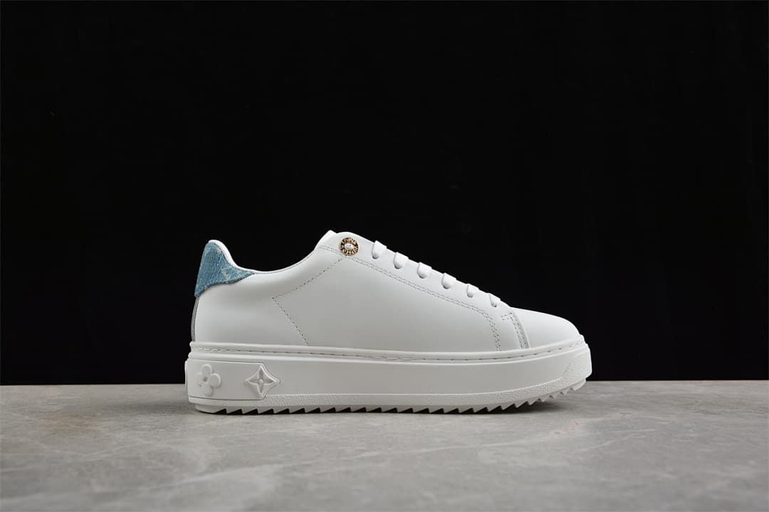Side view of the white sneaker and platform sole