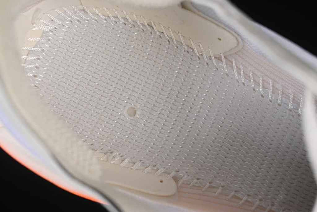 Close-up of the shoe's inner upper and stitched construction