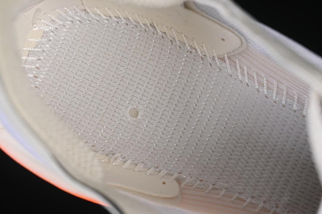 Close-up of the shoe's inner upper and stitched construction