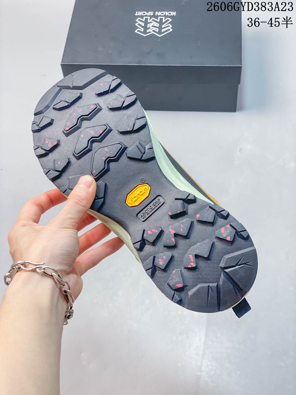 Close-up of the lugged outsole with Vibram Megagrip branding