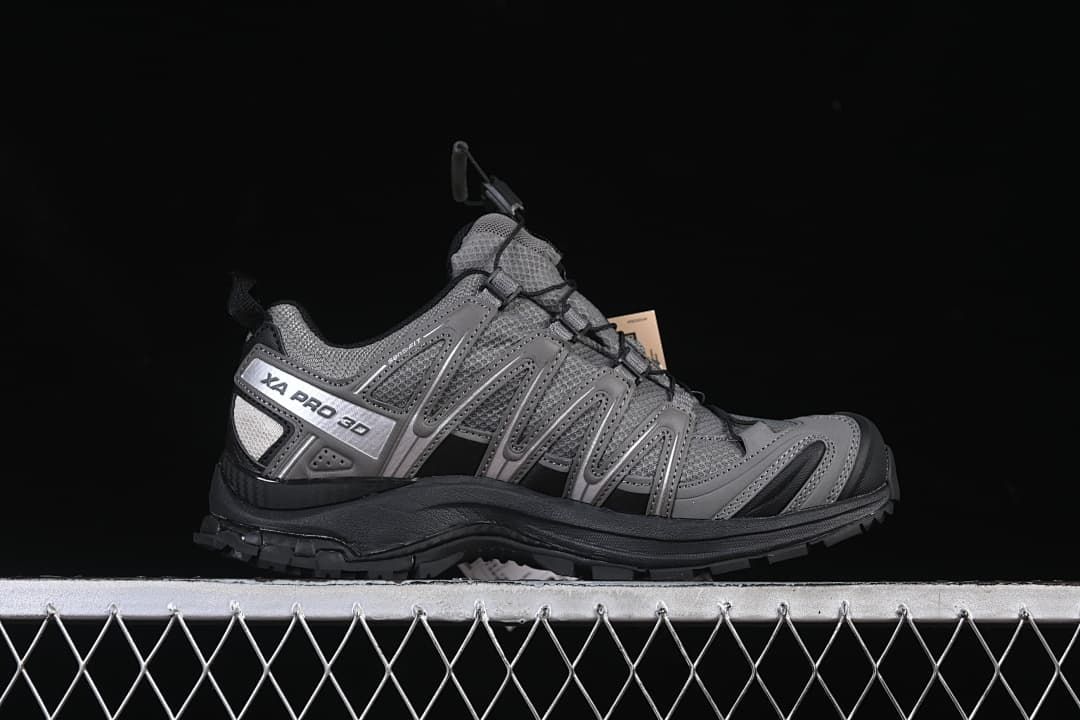 Side profile of a gray XA Pro 3D shoe with silver details and black outsole.