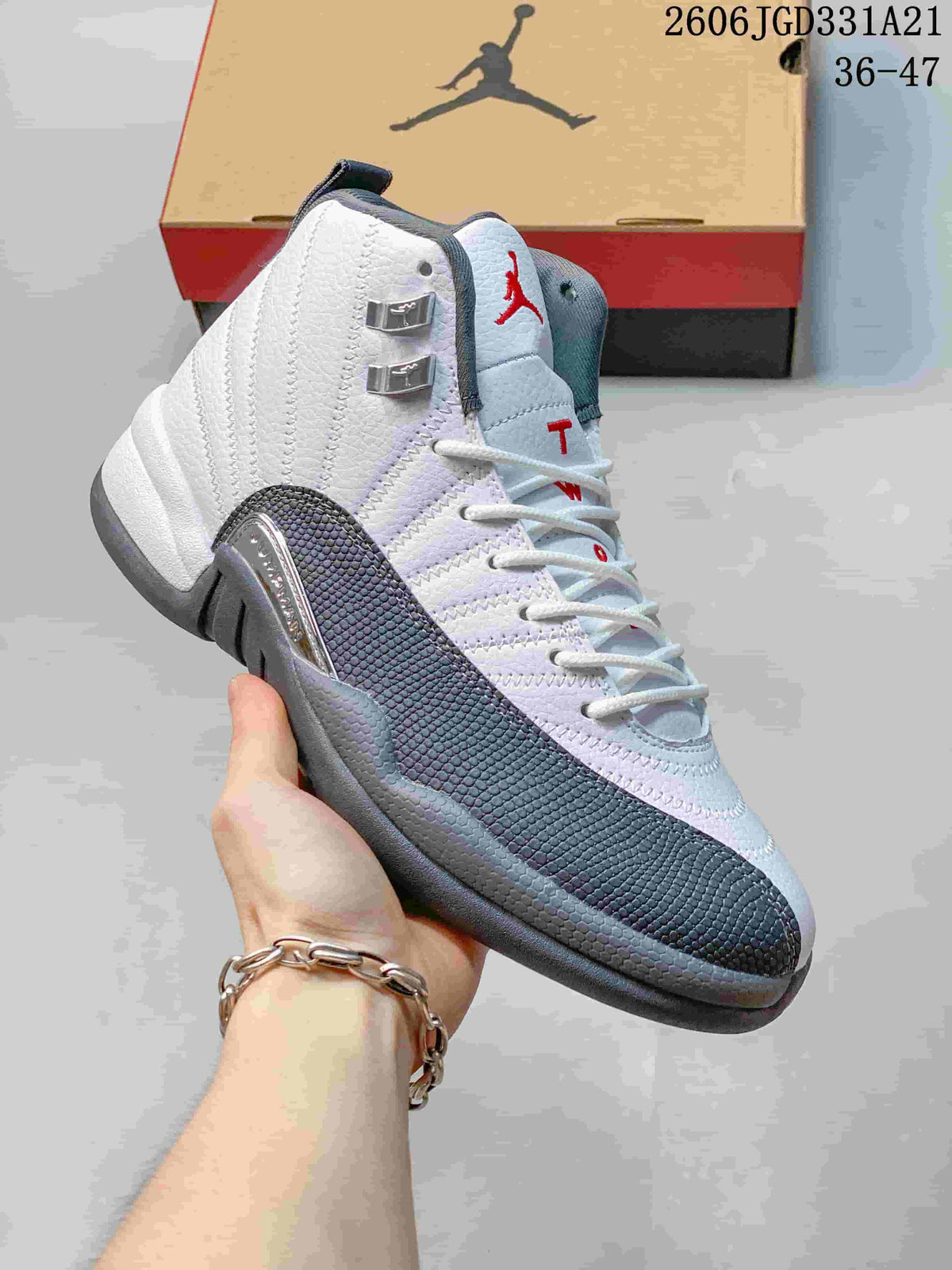 Angled side view of a white and grey Air Jordan 12 high-top shoe