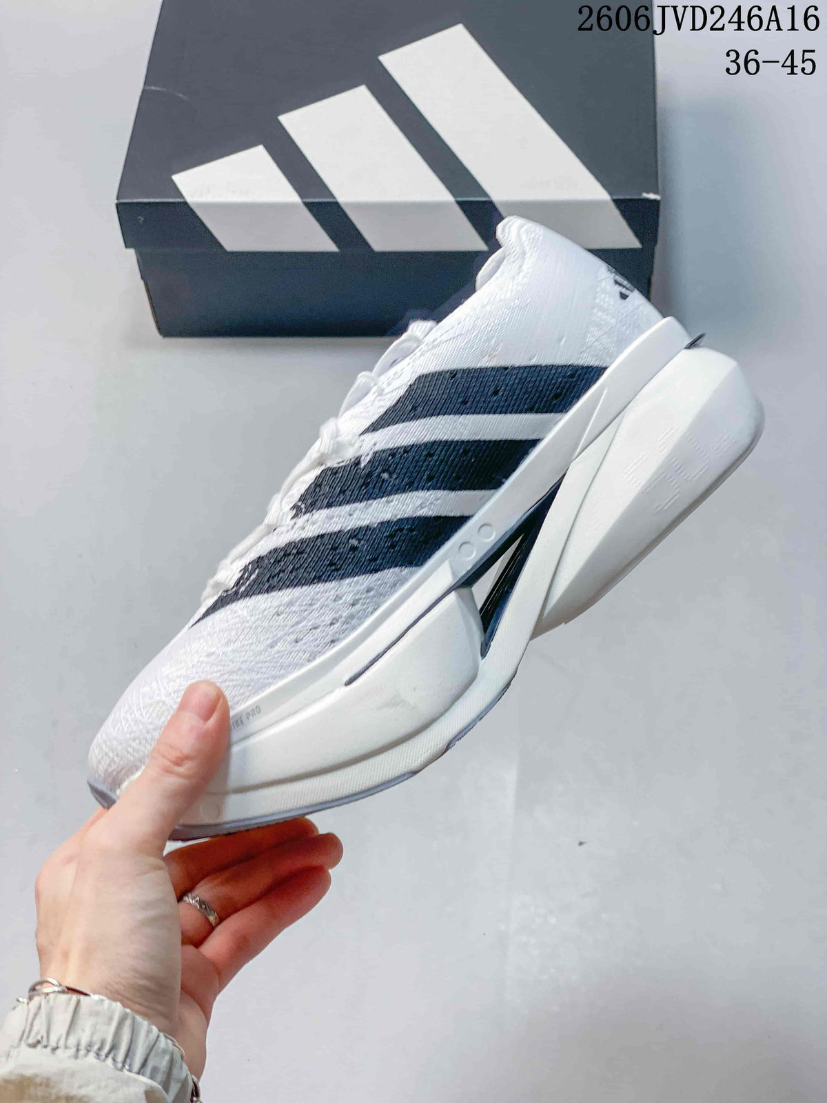 Side view showing the white upper, black stripes, and sculpted sole