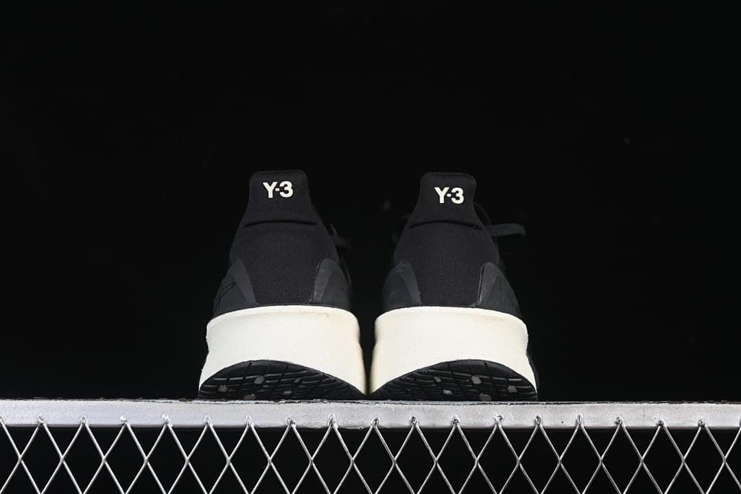 Rear view of the pair showing Y-3 heel branding and light-colored midsole sections