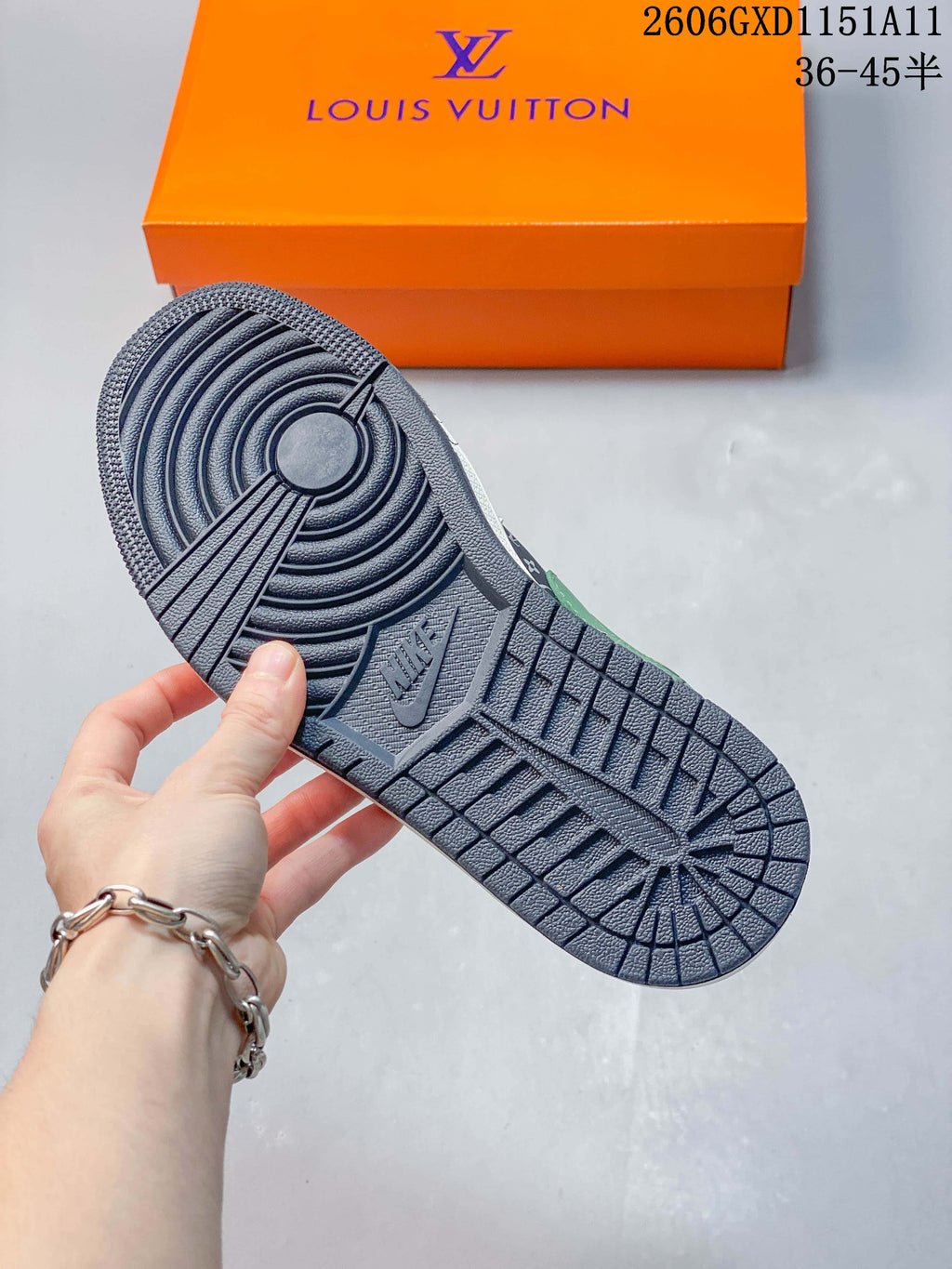 Close-up of the navy patterned outsole on the low-top sneaker.