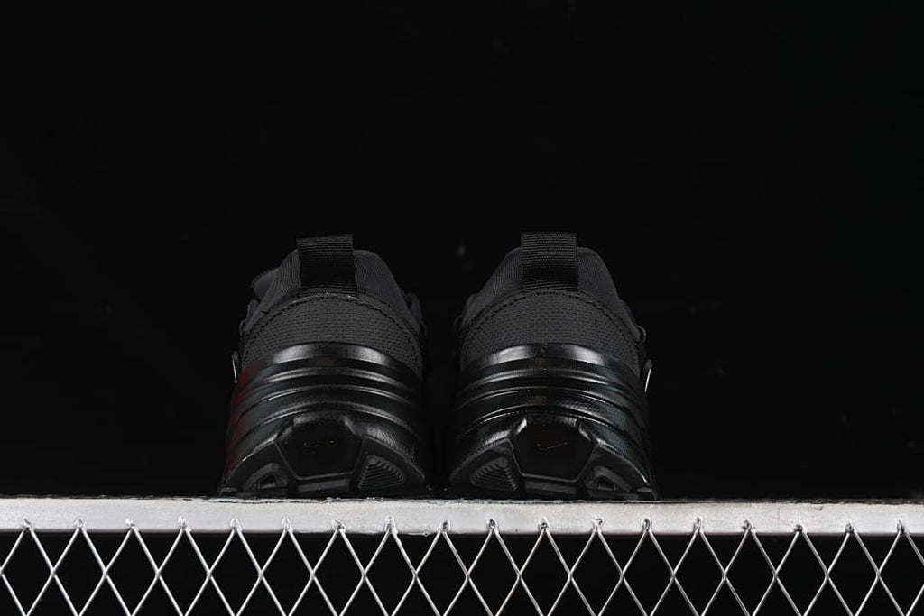 Rear view of both sneakers showing heel loops and outsole shape.