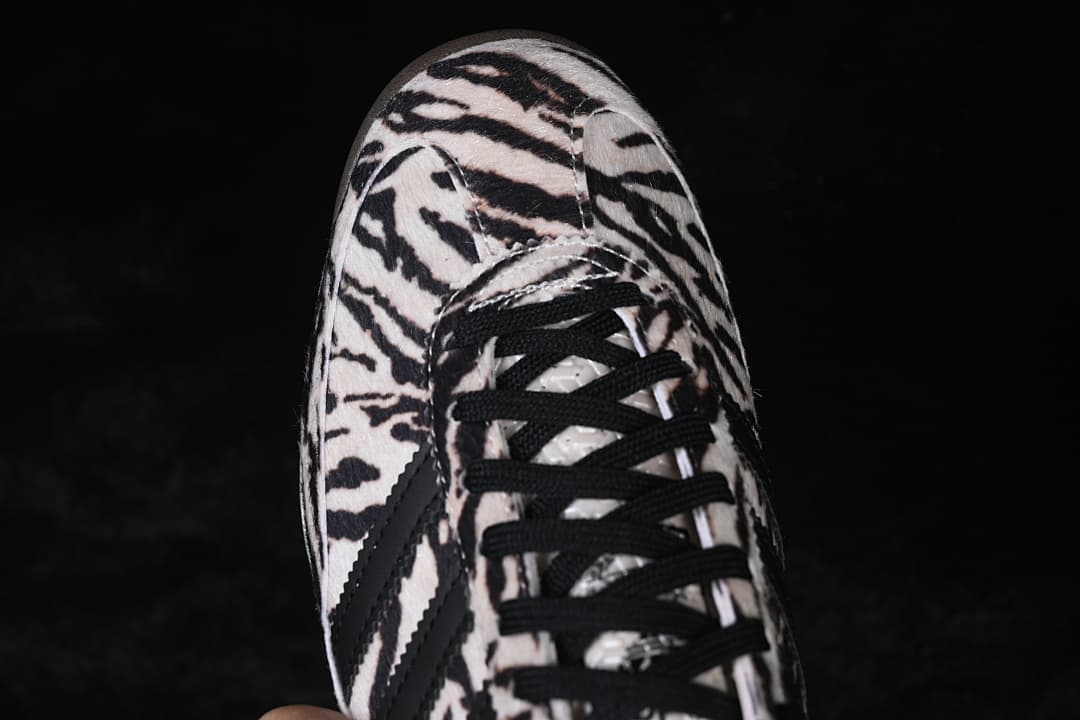 Top view of the sneaker showing its animal-print toe and black laces.