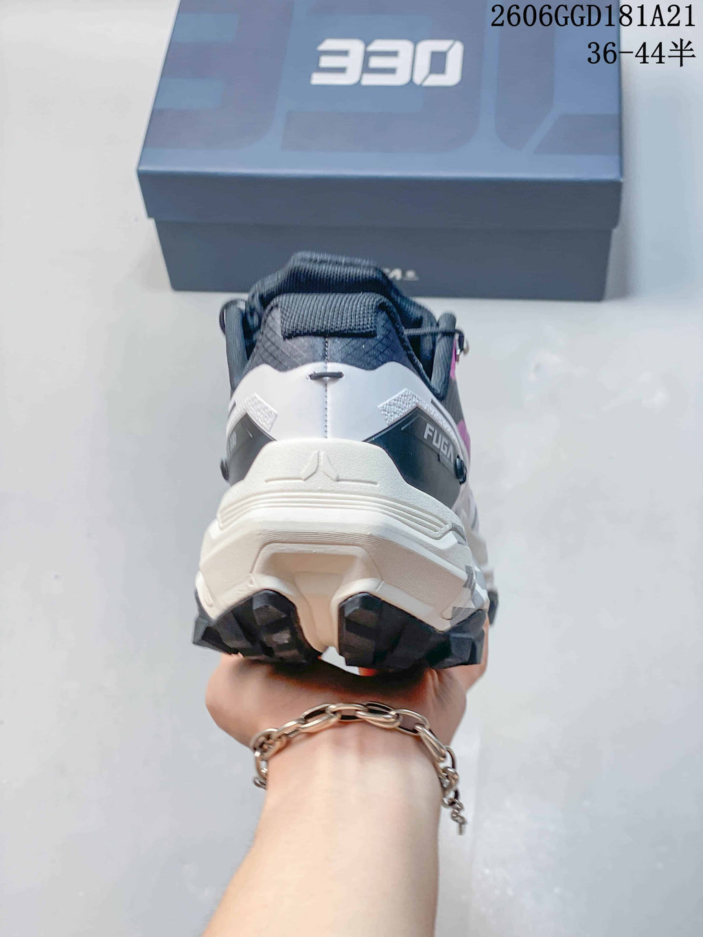 Rear view showing the heel and outsole of a trail shoe