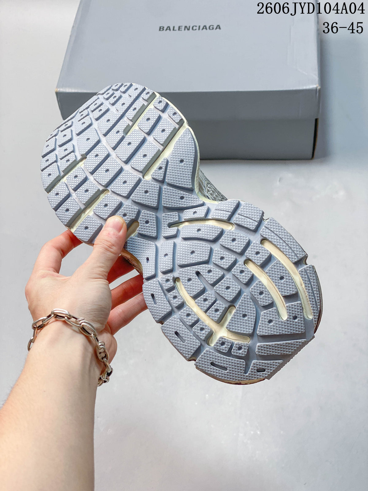 Close-up of the patterned outsole on a chunky sneaker