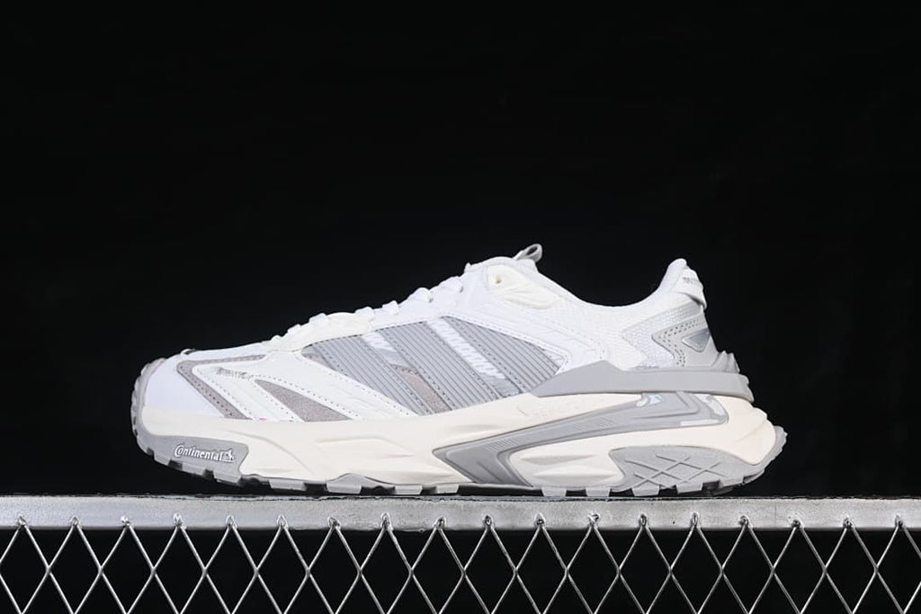 Side view of the sneaker showing its layered upper and chunky sole