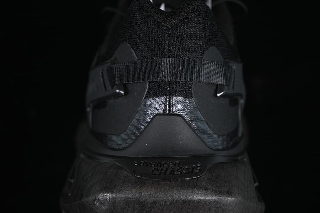 Rear view highlighting the heel structure and branding.
