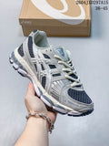 ASICS low-top sneaker in a light gray and white colorway, shown with a branded shoe box.