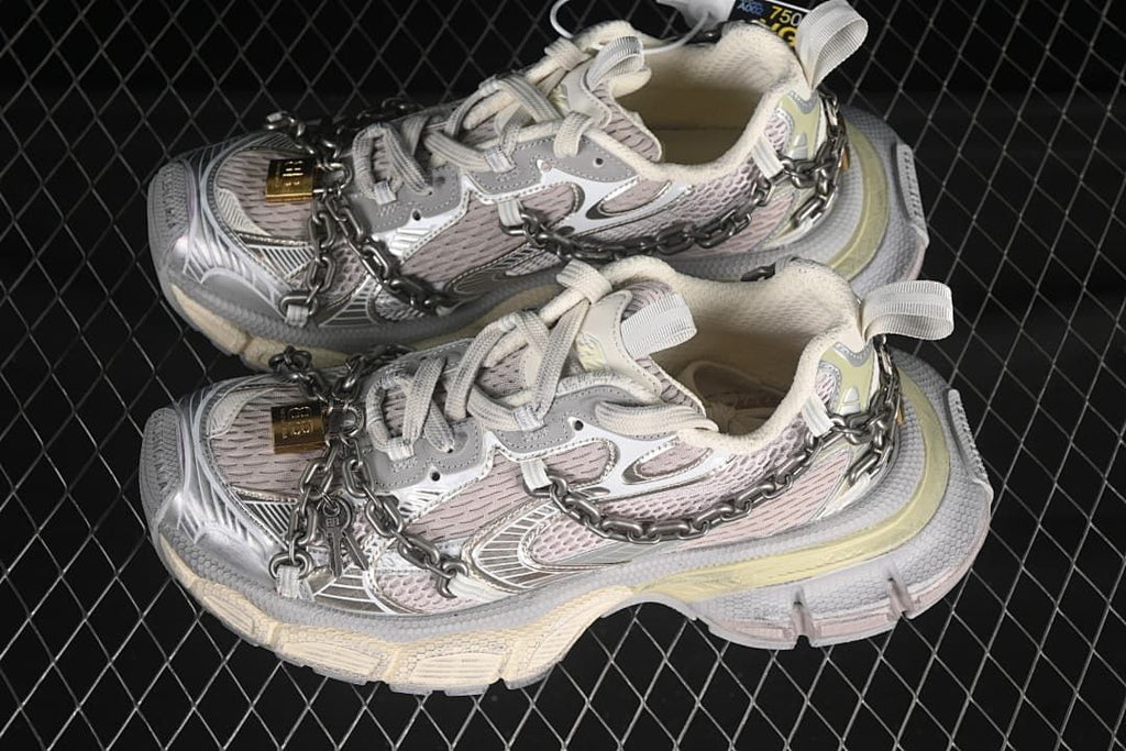 Pair of silver and grey chain sneakers shown from above.