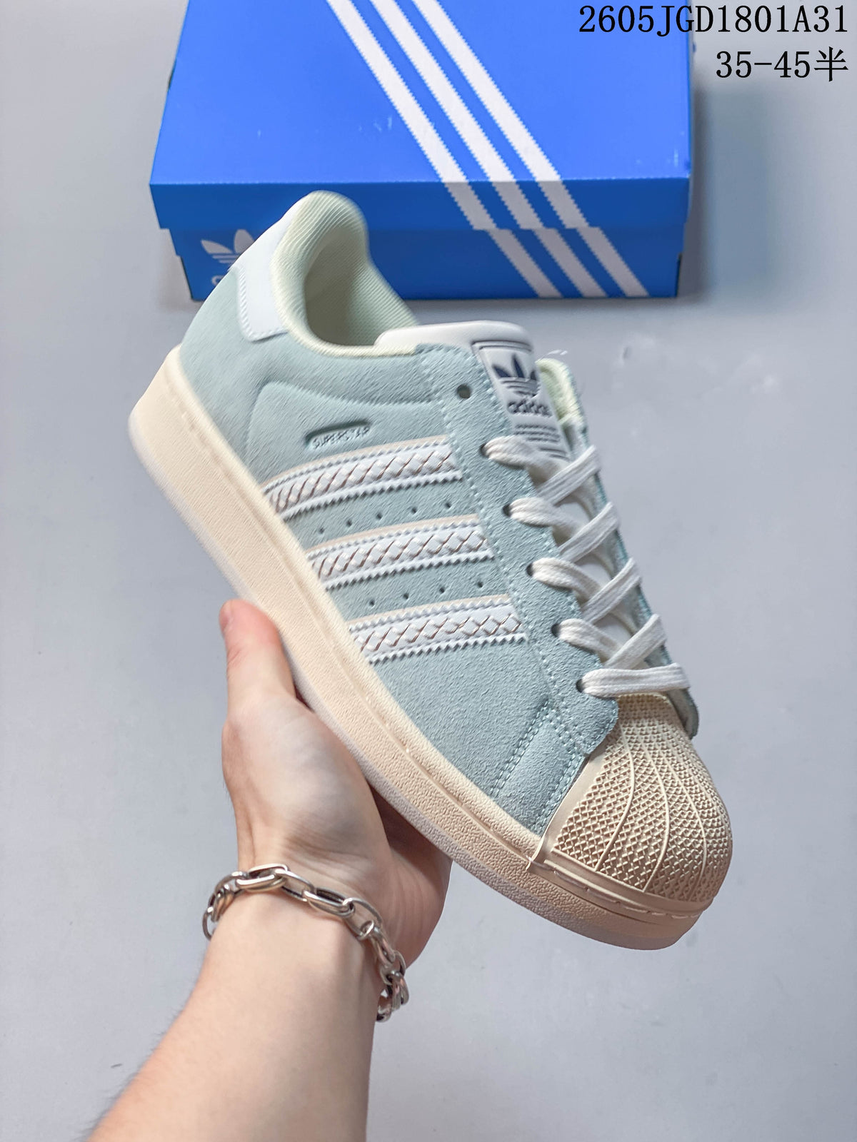 Angled view of the light blue Campus 00s sneaker with cream accents