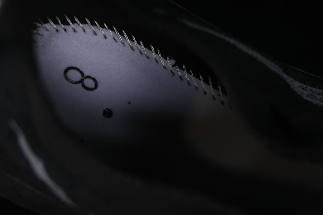 Close-up of interior stitching and printed detail inside the shoe