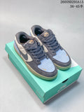 Pair of gray, cream, and light blue Nike SB Force 58 low-top shoes on a teal shoebox.