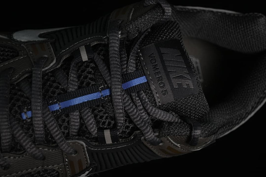 Top detail of laces, mesh tongue, and Vomero 5 tongue label