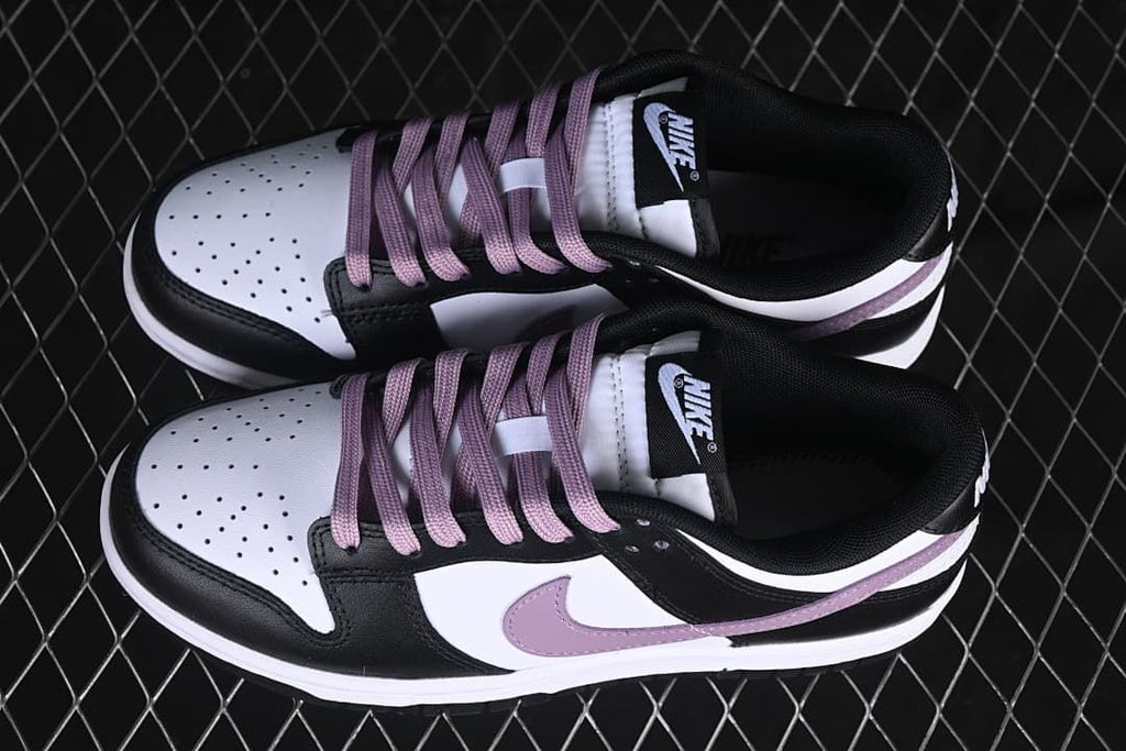 Overhead view of the pair of black, white, and purple sneakers
