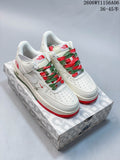 Pair of white low-top sneakers with red and green accents and multicolor laces