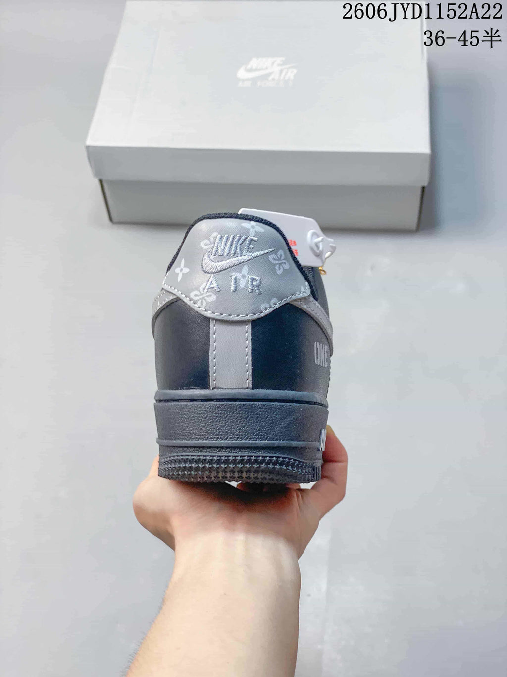 Rear view showing the gray heel panel and embroidered-style graphics