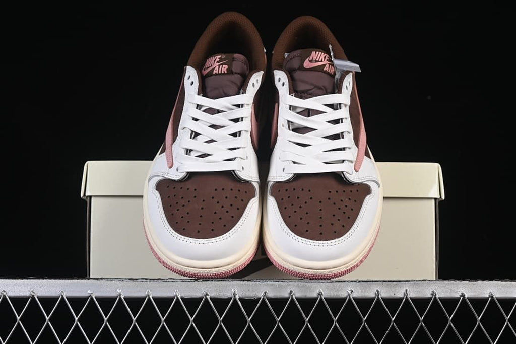 Front view of the pair showing brown perforated toe panels and pink tongue branding.