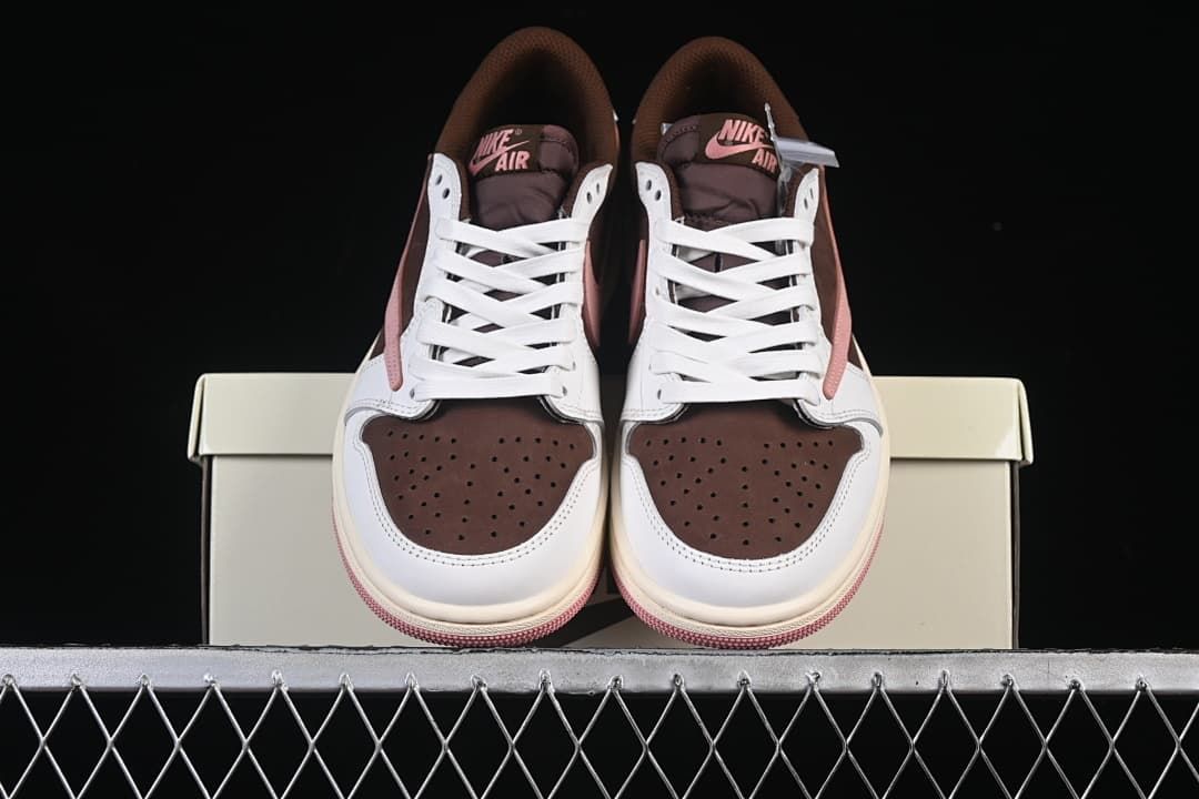 Front view of the pair showing brown perforated toe panels and pink tongue branding.