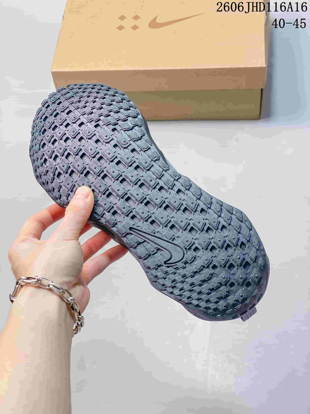 Textured outsole of a gray Nike Ava Rover Hs shoe