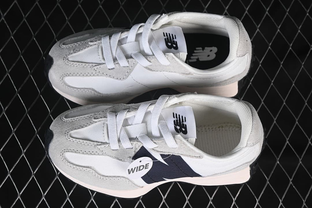 Overhead view of the pair with a visible wide-fit tag.