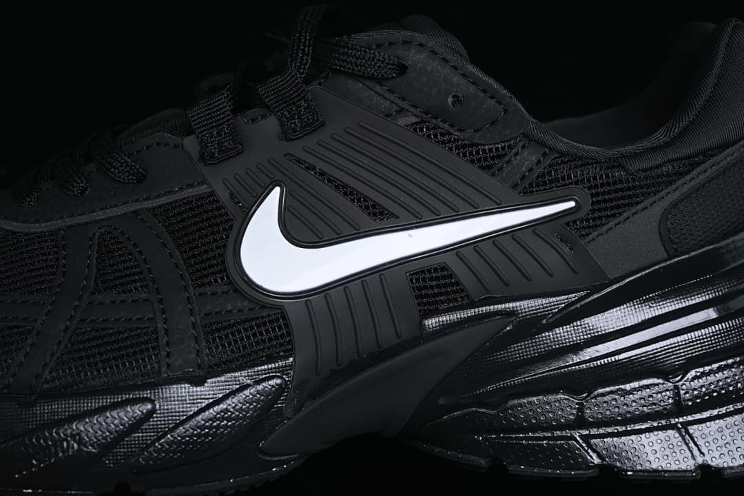 Close-up of the side Swoosh and layered upper