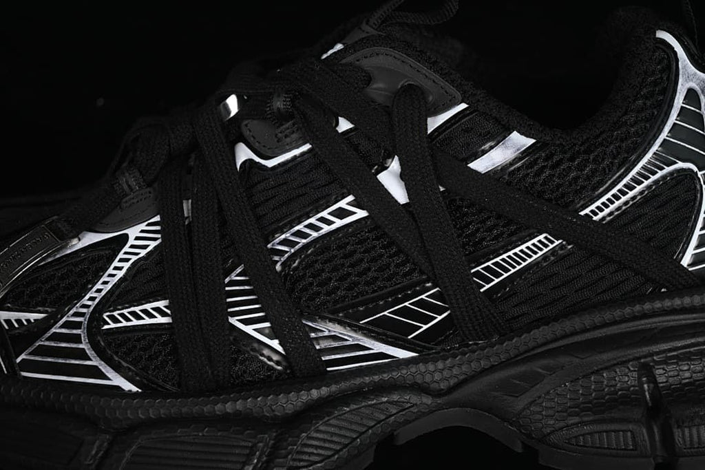 Close-up of the black upper, laces, and white graphic overlays.