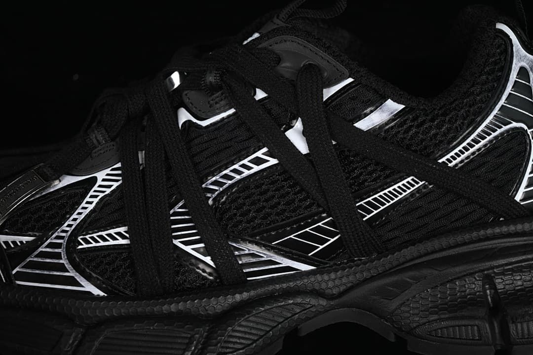 Close-up of the black upper, laces, and white graphic overlays.