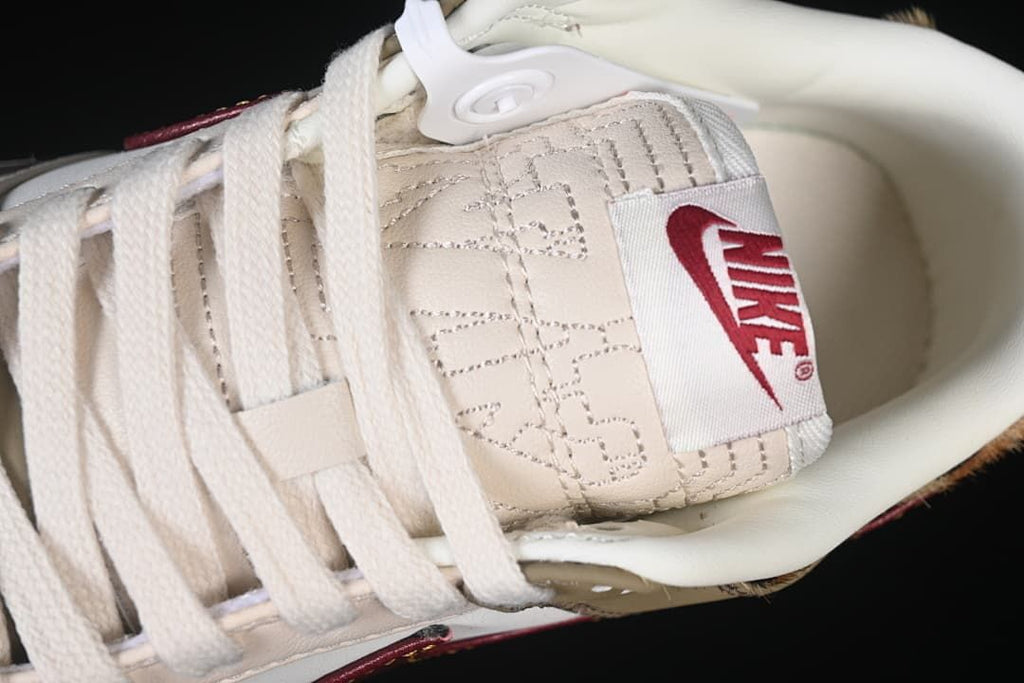 Close-up of the cream laces and stitched tongue label