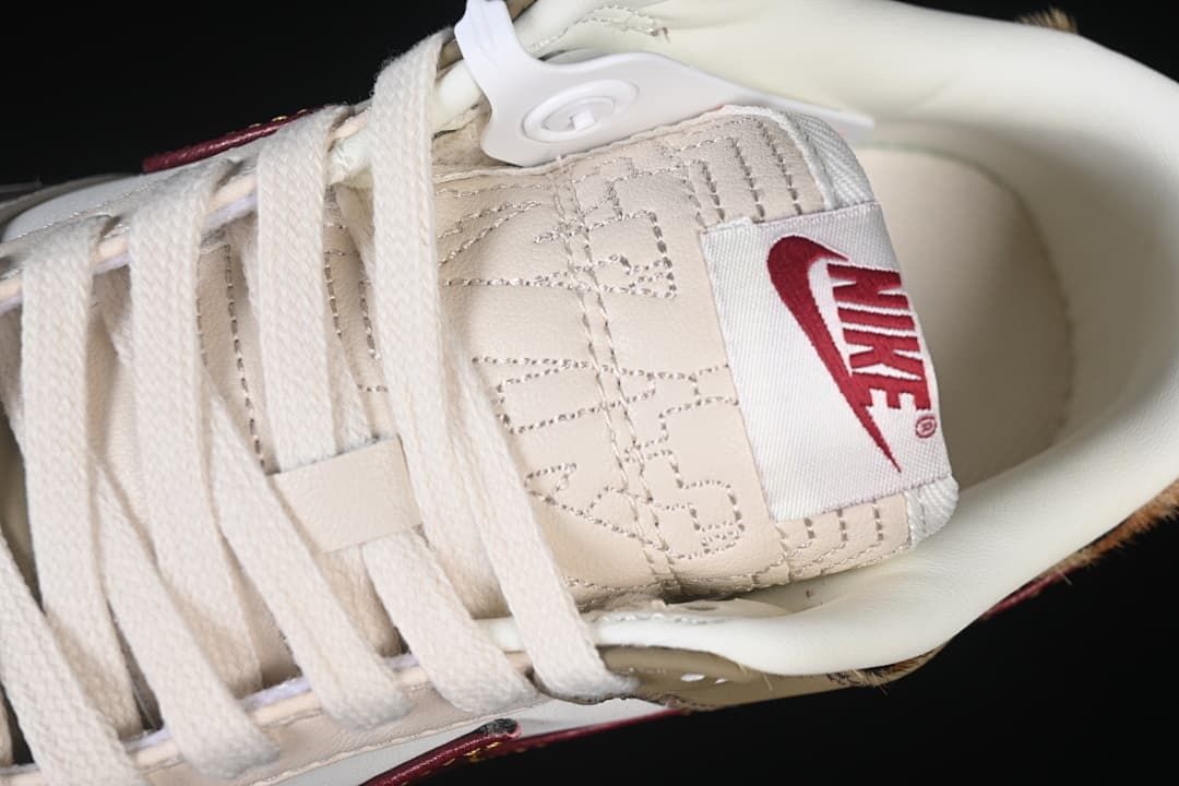 Close-up of the cream laces and stitched tongue label