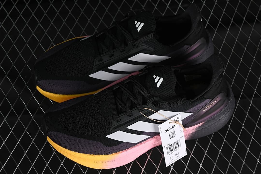 Pair of black Ultraboost 5X shoes with white stripes and a gradient midsole.