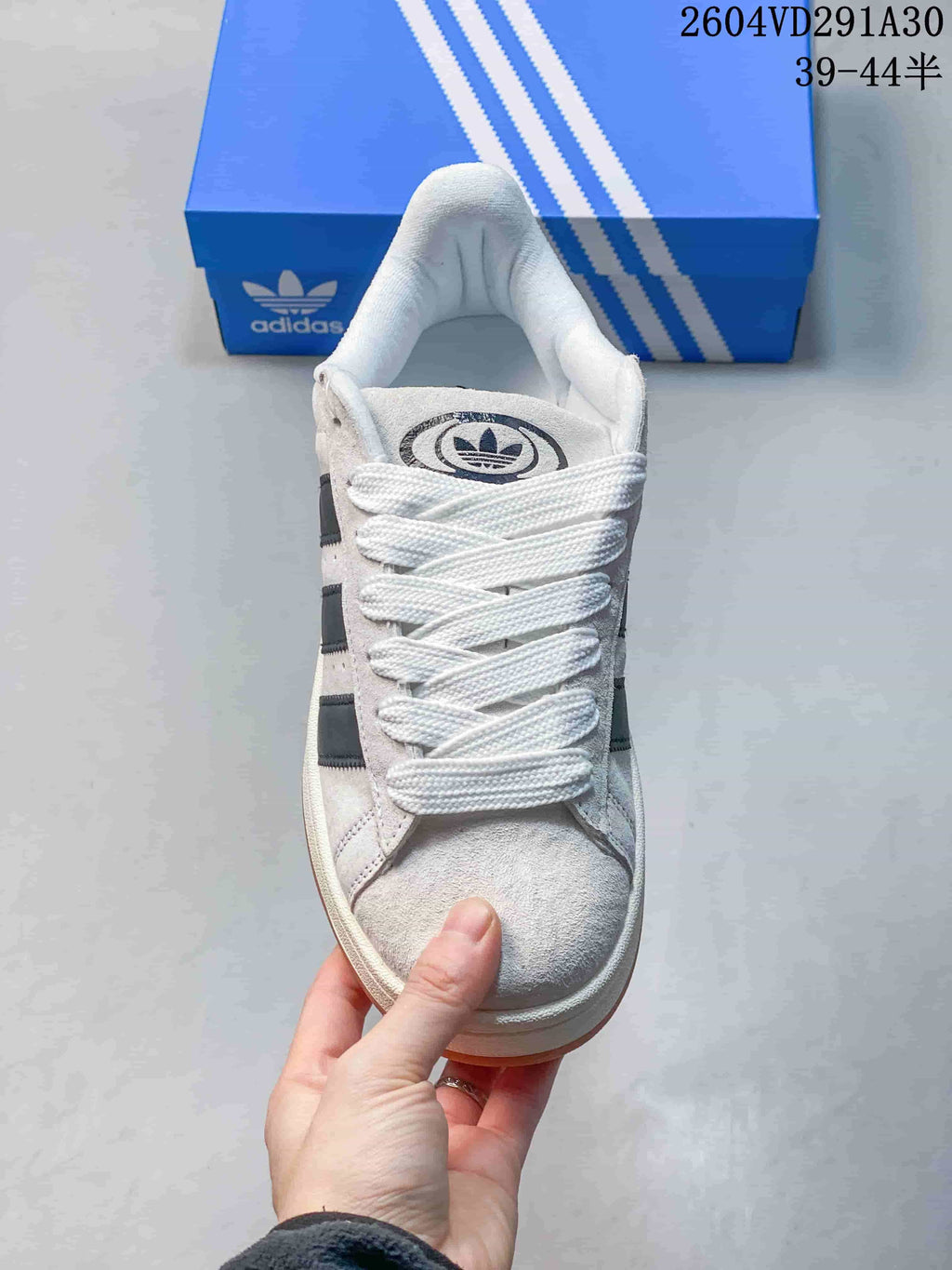 Front view showing the laces, rounded toe and tongue branding.