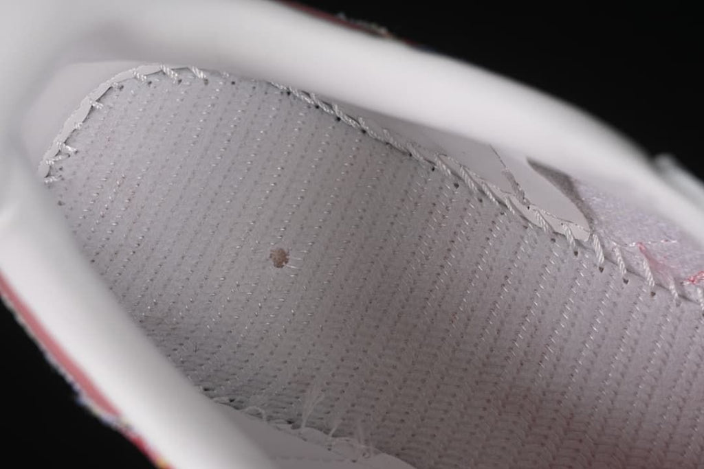 Close-up of the shoe's light-colored stitched interior lining