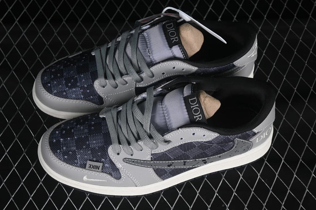 Top view of a pair of gray and dark patterned low-top sneakers with gray laces