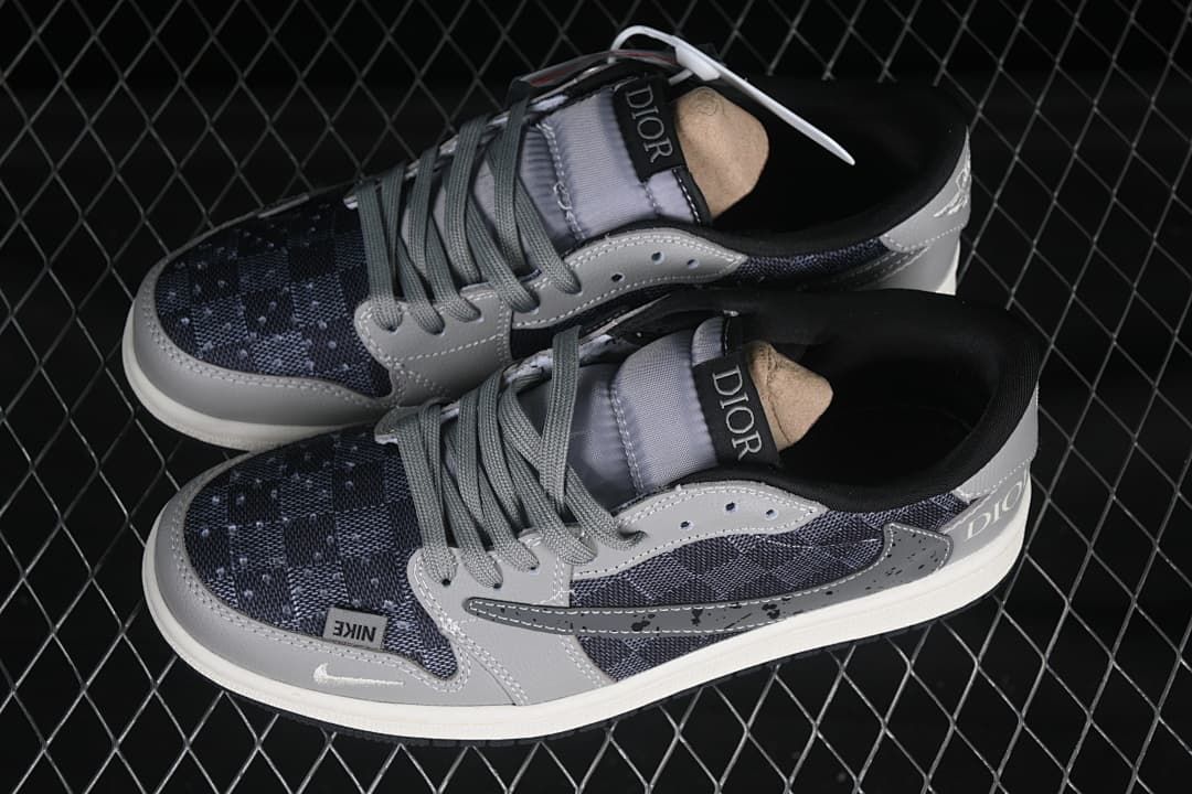 Top view of a pair of gray and dark patterned low-top sneakers with gray laces