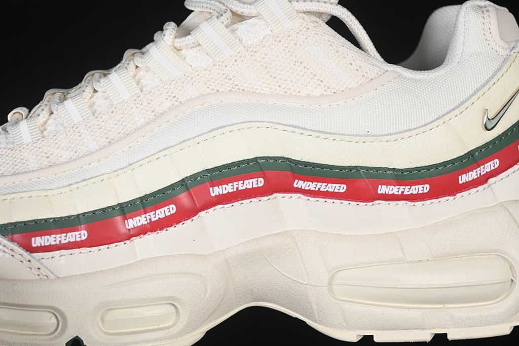 Close-up of the layered side panels and repeated Undefeated branding.